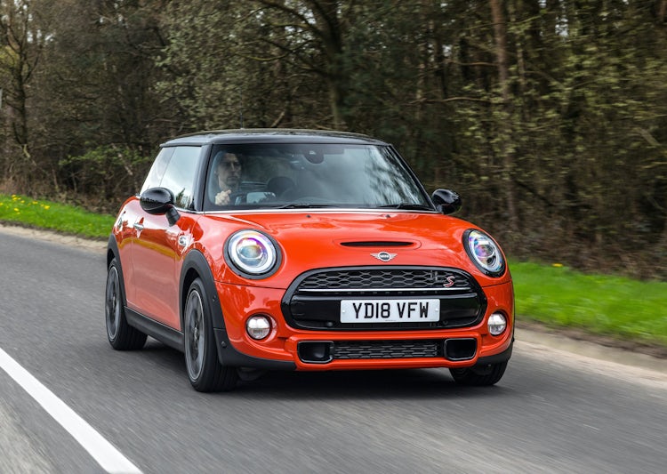 Mini hatch orange driving